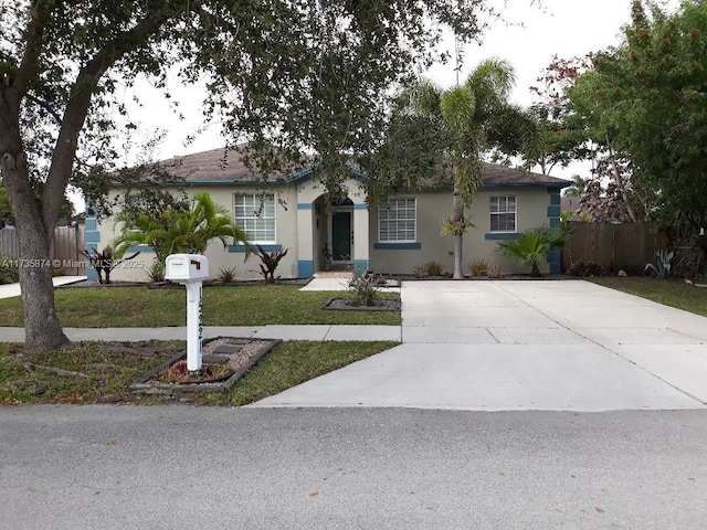 ranch-style home with a front yard