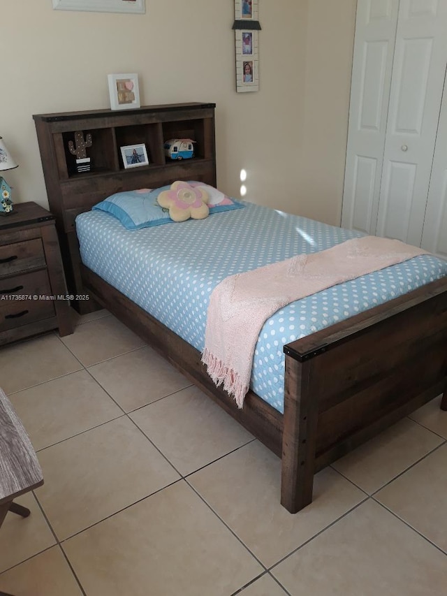 bedroom featuring light tile patterned floors