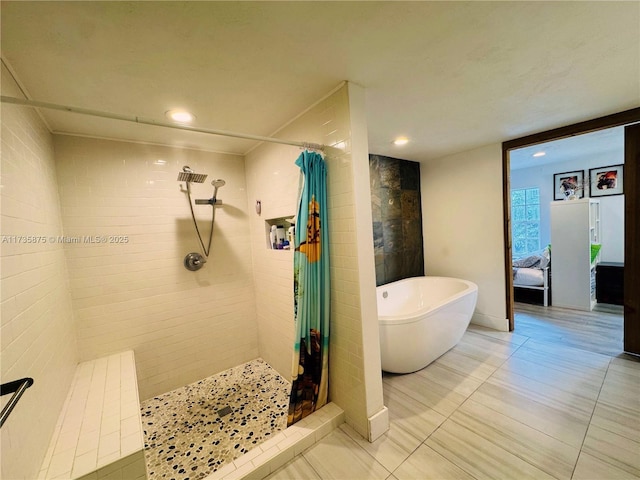 bathroom featuring separate shower and tub