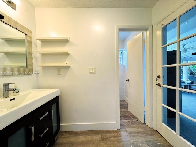 bathroom featuring vanity and wood-type flooring