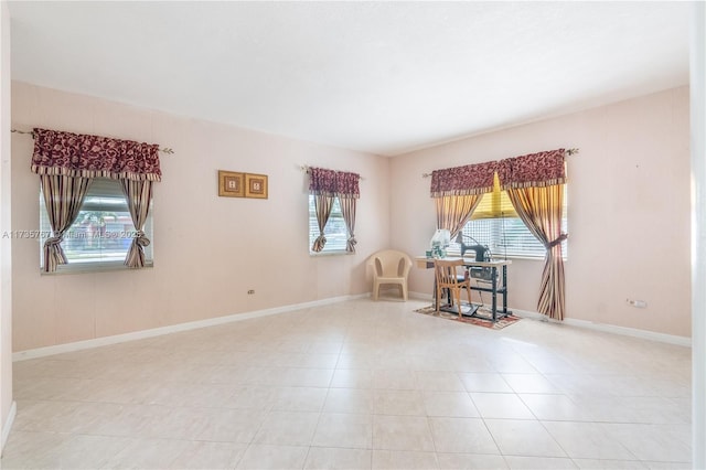 sitting room featuring a healthy amount of sunlight and light tile patterned floors