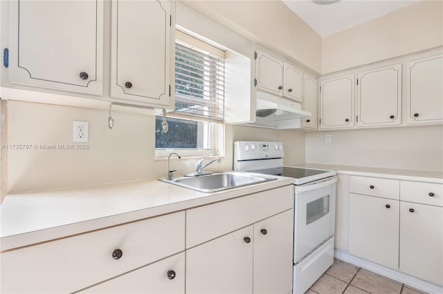 kitchen featuring white cabinetry, light tile patterned flooring, sink, and white range with electric stovetop