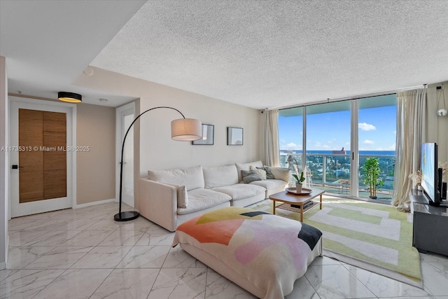 living room with a wall of windows and a textured ceiling