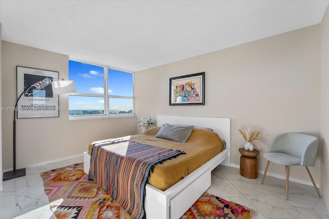 bedroom featuring a textured ceiling