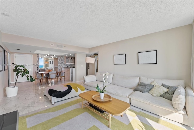 living room featuring a textured ceiling