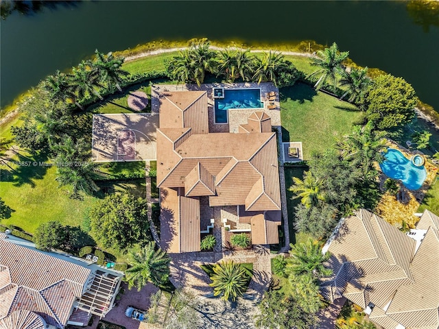 birds eye view of property featuring a water view