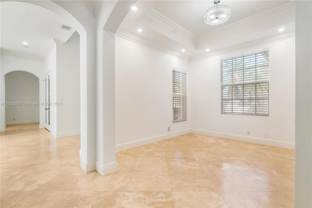 empty room featuring crown molding