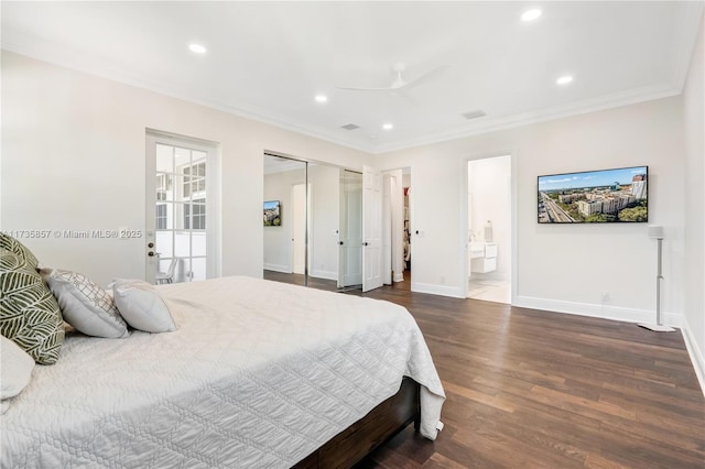 bedroom with dark hardwood / wood-style flooring, ceiling fan, crown molding, ensuite bath, and a closet