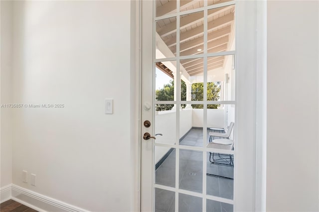 doorway featuring lofted ceiling