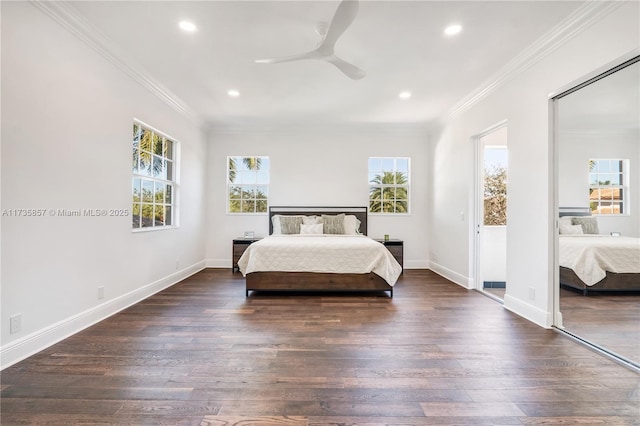 bedroom featuring dark hardwood / wood-style flooring, ornamental molding, and ceiling fan