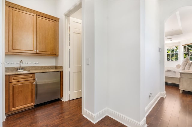 interior space featuring sink and dark hardwood / wood-style flooring