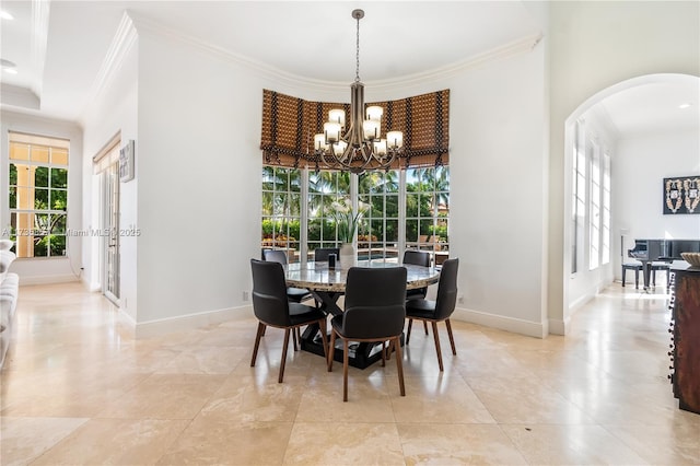 tiled dining space featuring crown molding, a chandelier, and a wealth of natural light