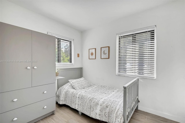 bedroom with light wood-type flooring