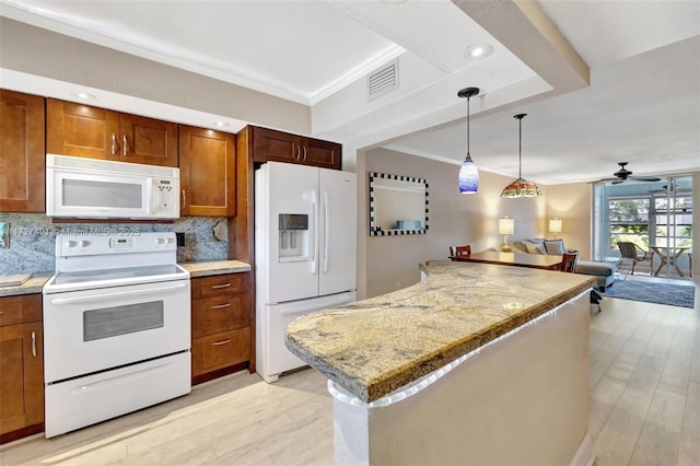 kitchen featuring white appliances, tasteful backsplash, visible vents, open floor plan, and pendant lighting