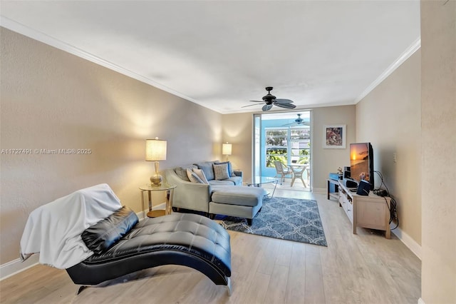 700 SE 6th Ave Unit 203, Deerfield Beach, FL 33441 - living room featuring ceiling fan, ornamental molding, light wood-style flooring, and baseboards