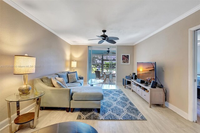 700 SE 6th Ave Unit 203, Deerfield Beach, FL 33441 - living room with light wood-type flooring, baseboards, ornamental molding, and a ceiling fan