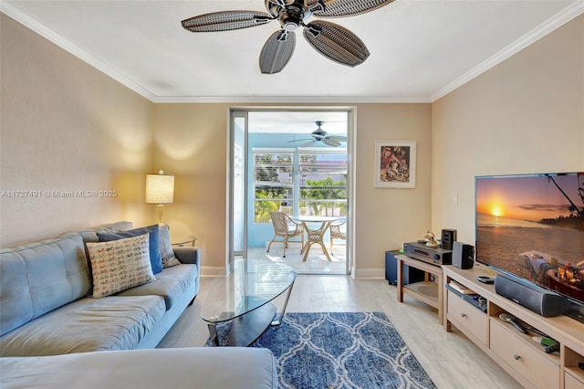 700 SE 6th Ave Unit 203, Deerfield Beach, FL 33441 - living room featuring a ceiling fan, light wood-style flooring, baseboards, and crown molding