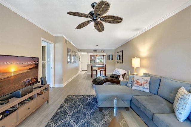 700 SE 6th Ave Unit 203, Deerfield Beach, FL 33441 - living area with ceiling fan, ornamental molding, light wood-type flooring, and baseboards