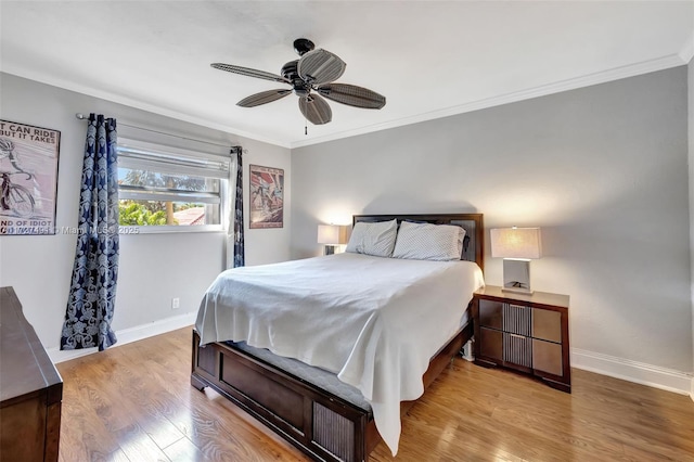 700 SE 6th Ave Unit 203, Deerfield Beach, FL 33441 - bedroom with light wood-style flooring, baseboards, ceiling fan, and crown molding