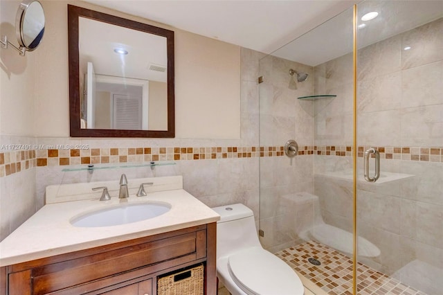 700 SE 6th Ave Unit 203, Deerfield Beach, FL 33441 - bathroom featuring toilet, visible vents, vanity, tile walls, and a shower stall