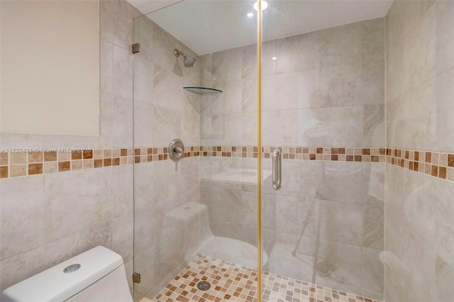 700 SE 6th Ave Unit 203, Deerfield Beach, FL 33441 - full bathroom featuring a stall shower, tile walls, and toilet