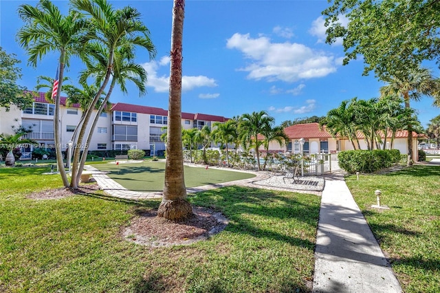 700 SE 6th Ave Unit 203, Deerfield Beach, FL 33441 - view of community with a residential view and a lawn