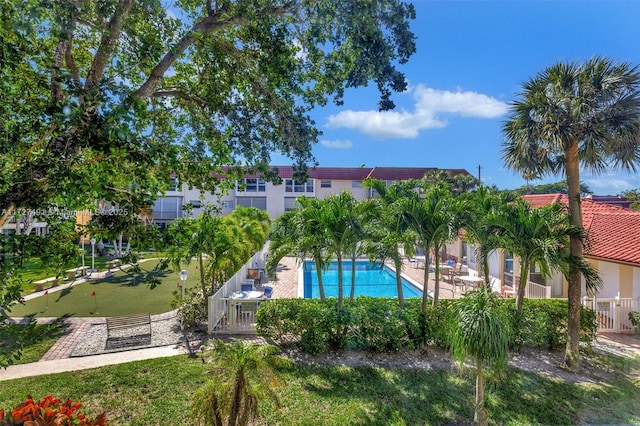 700 SE 6th Ave Unit 203, Deerfield Beach, FL 33441 - community pool featuring a patio and fence