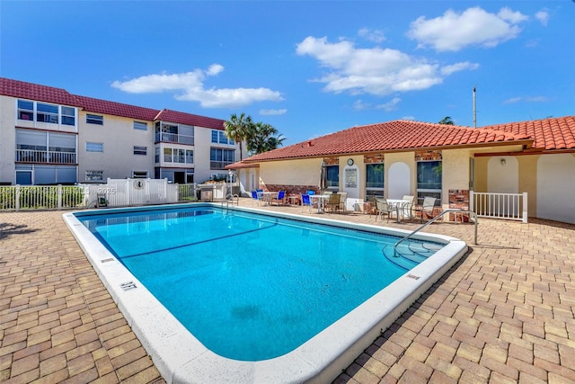 700 SE 6th Ave Unit 203, Deerfield Beach, FL 33441 - community pool featuring a patio and fence