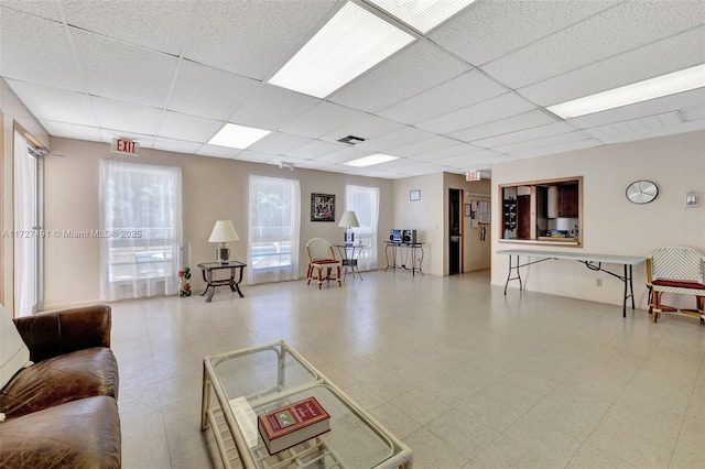 700 SE 6th Ave Unit 203, Deerfield Beach, FL 33441 - living room with visible vents, a drop ceiling, and tile patterned floors