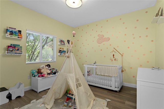 bedroom with hardwood / wood-style flooring