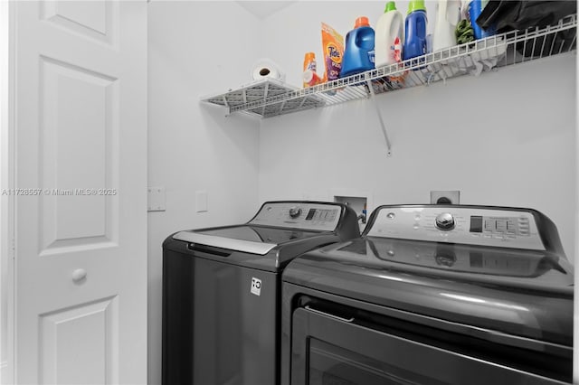 laundry area with separate washer and dryer