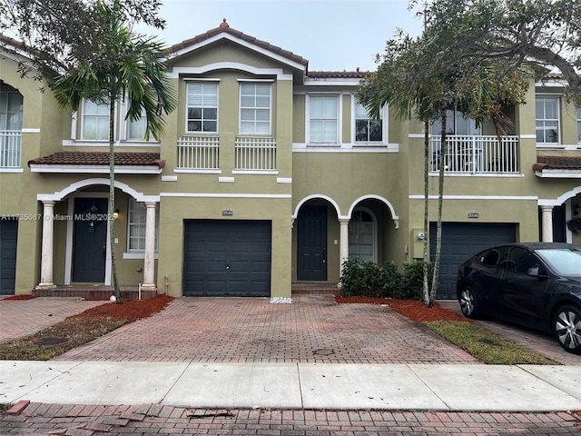 multi unit property featuring a garage