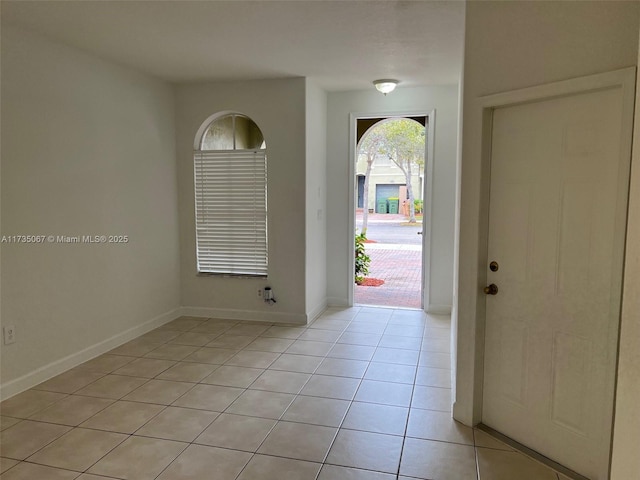 foyer entrance with light tile patterned floors