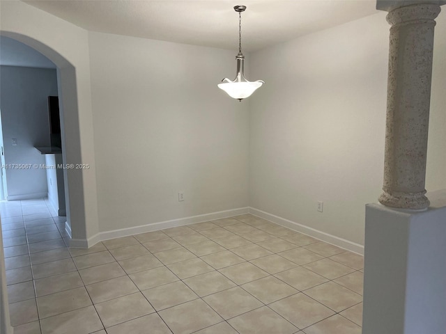 empty room featuring decorative columns