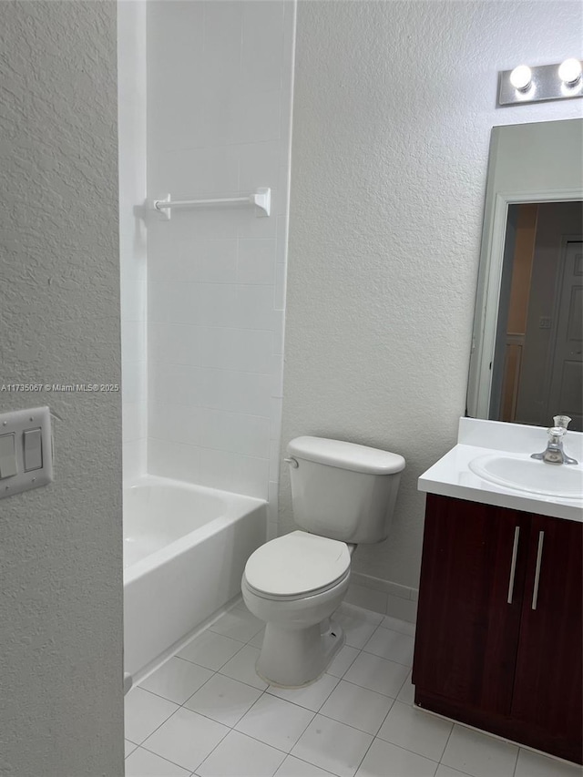 full bathroom with tile patterned flooring, vanity, shower / washtub combination, and toilet