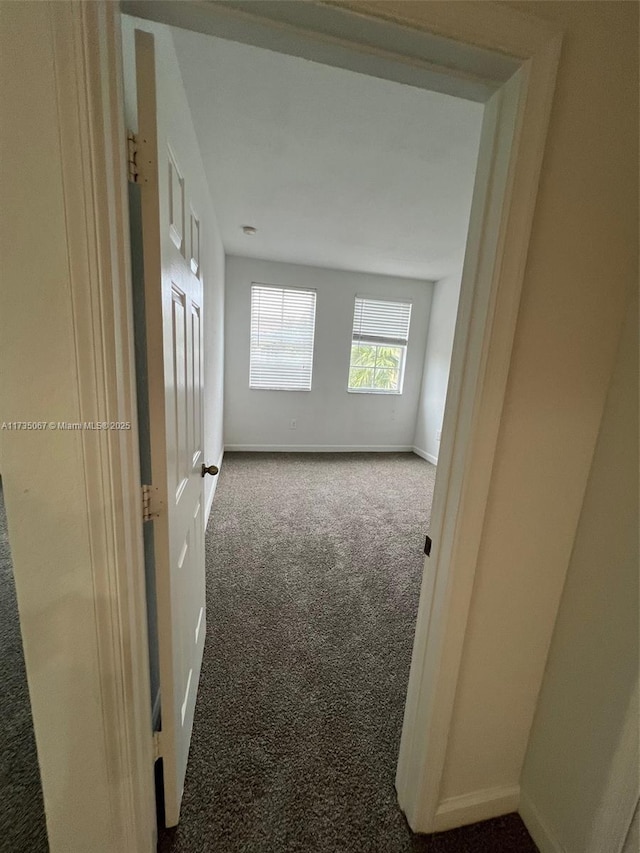 hall with carpet floors