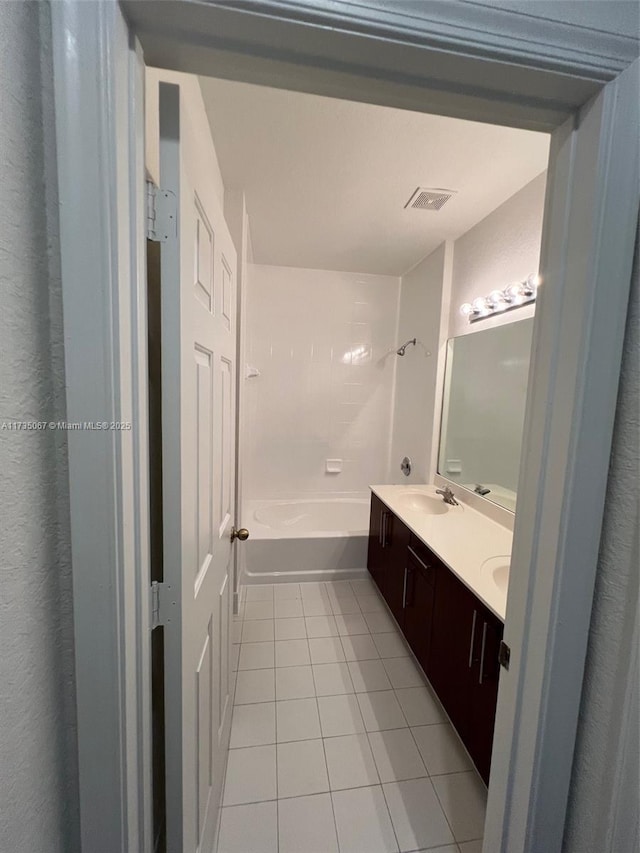 bathroom with vanity,  shower combination, and tile patterned flooring