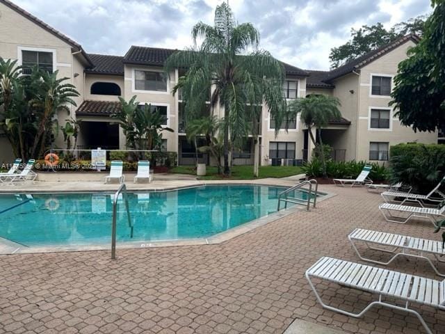 view of swimming pool with a patio area