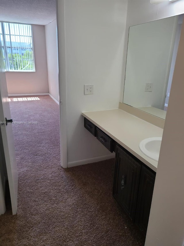 bathroom featuring vanity and a textured ceiling