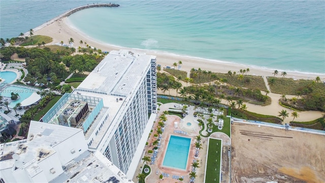 drone / aerial view featuring a water view and a beach view