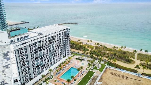 drone / aerial view with a water view and a view of the beach