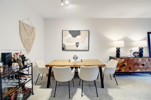 view of carpeted dining area