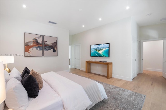 bedroom with light hardwood / wood-style floors