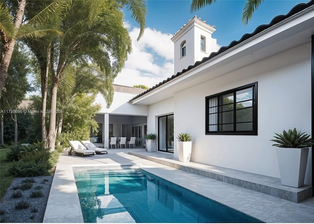 view of swimming pool featuring a patio area