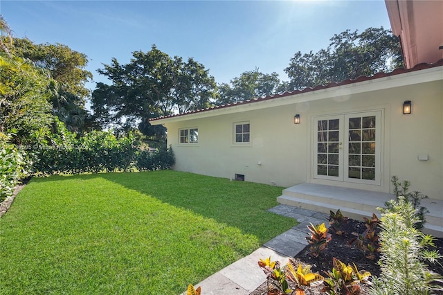 view of yard featuring french doors