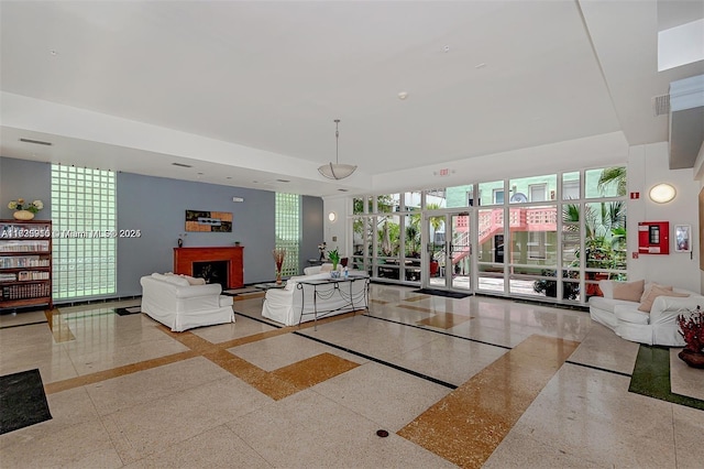 living room with a fireplace and visible vents