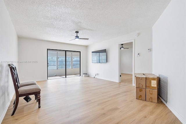 4050 NW 42nd Ave Unit 318, Fort Lauderdale, FL 33319 - spare room featuring ceiling fan, light hardwood / wood-style flooring, and a textured ceiling