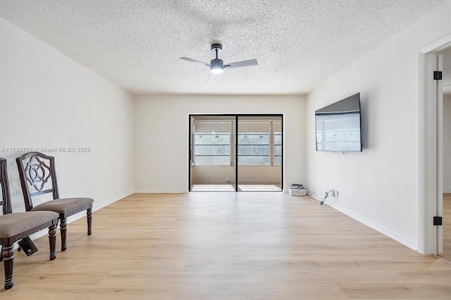 4050 NW 42nd Ave Unit 318, Fort Lauderdale, FL 33319 - living area featuring ceiling fan, light hardwood / wood-style flooring, and a textured ceiling