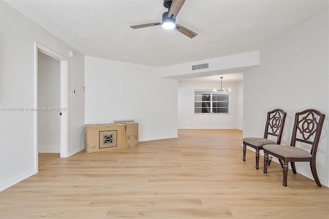 4050 NW 42nd Ave Unit 318, Fort Lauderdale, FL 33319 - living area featuring ceiling fan, light hardwood / wood-style flooring, and a textured ceiling
