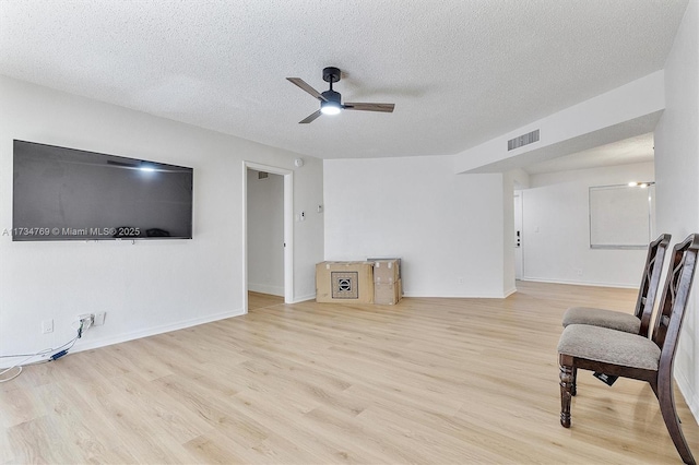 4050 NW 42nd Ave Unit 318, Fort Lauderdale, FL 33319 - sitting room featuring ceiling fan, a textured ceiling, and light wood-type flooring